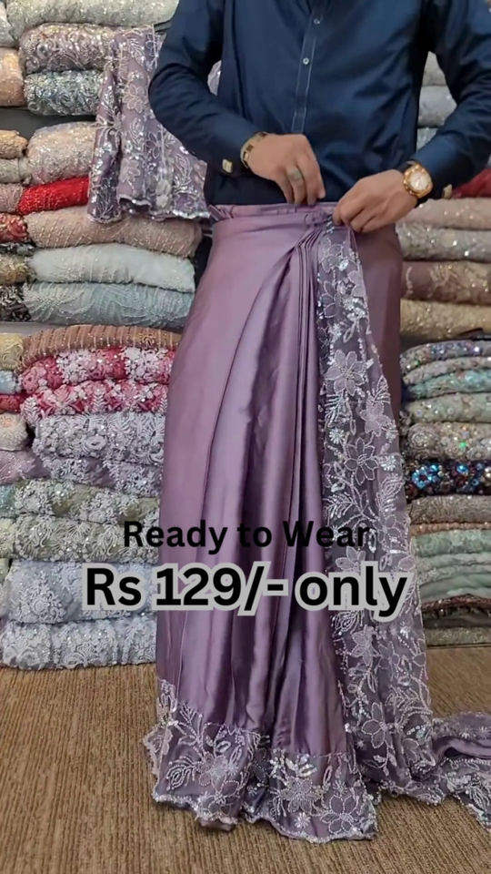 Elegant Purple Net Saree with Intricate Design