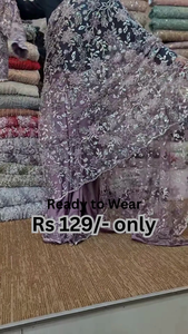 Elegant Purple Net Saree with Intricate Design