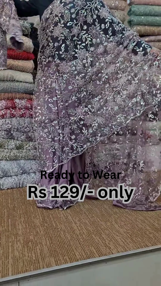 Elegant Purple Net Saree with Intricate Design