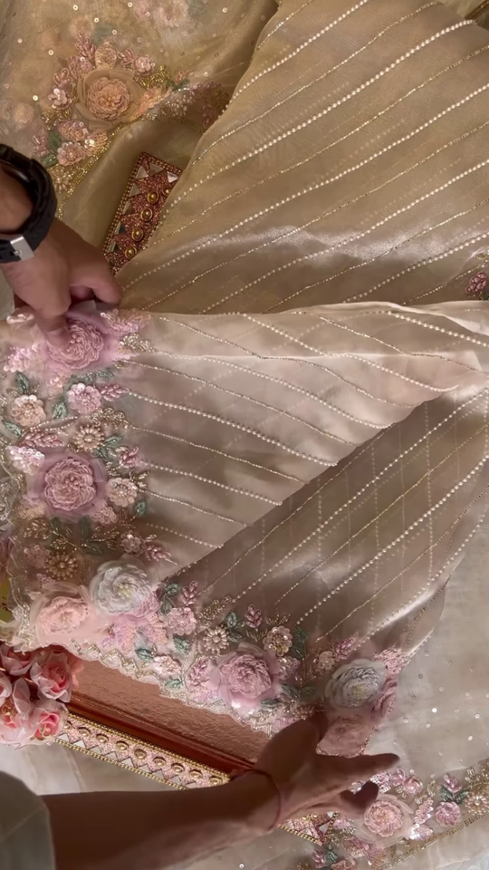 Elegant Embroidered Saree with Floral Motifs and Pearl Accents